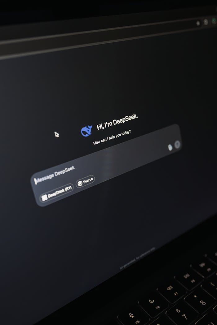 Services-02 Close-up of a laptop screen displaying an AI chatbot interface with a dark theme.